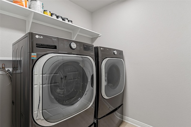 3625 Beutel Rd, Waco, TX 76655 - laundry area with washing machine and dryer and baseboards
