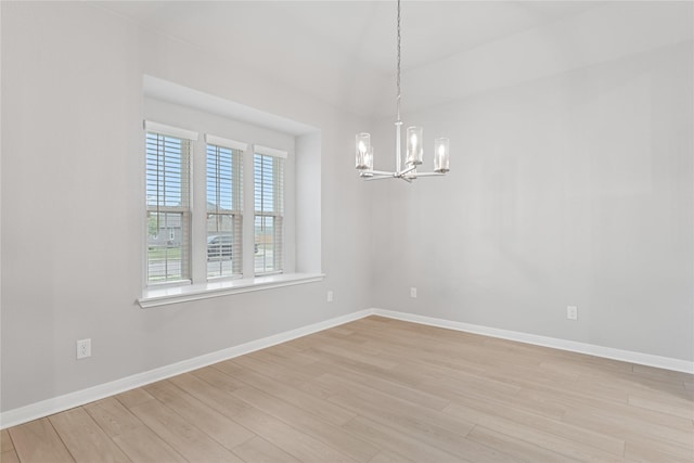 3625 Beutel Rd, Waco, TX 76655 - unfurnished room with a chandelier, light wood-style floors, and baseboards