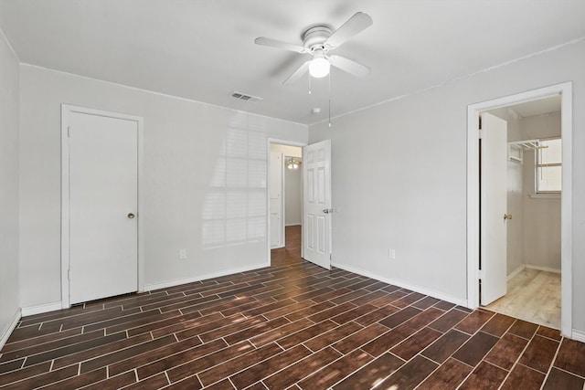 6529 Wooddale Dr, Watauga, TX 76148 - unfurnished bedroom with wood finished floors, baseboards, a closet, and a ceiling fan