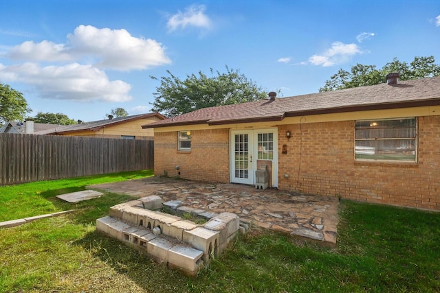 6529 Wooddale Dr, Watauga, TX 76148 - back of property with brick siding and a patio
