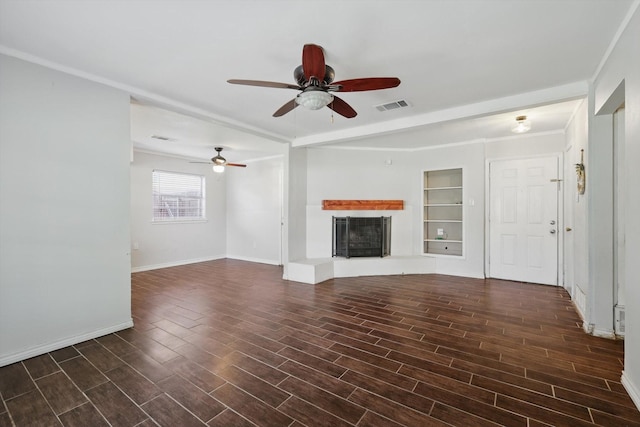 6529 Wooddale Dr, Watauga, TX 76148 - unfurnished living room with a ceiling fan, wood finished floors, a fireplace with raised hearth, baseboards, and crown molding