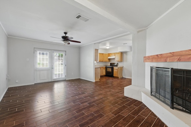 6529 Wooddale Dr, Watauga, TX 76148 - unfurnished living room featuring a ceiling fan, a tiled fireplace, dark wood finished floors, baseboards, and crown molding