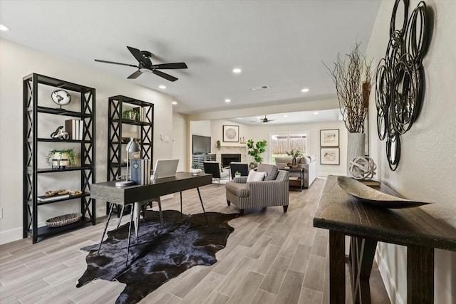 6210 Maple Springs Dr, Arlington, TX 76001 - office space featuring a ceiling fan, light wood-style flooring, a fireplace, recessed lighting, and baseboards