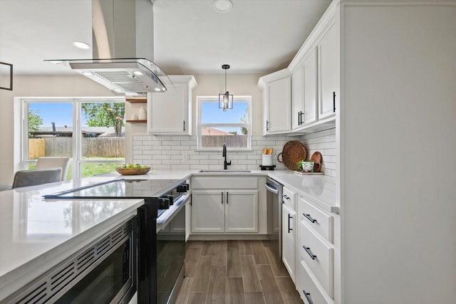 6210 Maple Springs Dr, Arlington, TX 76001 - kitchen featuring a sink, island range hood, built in appliances, plenty of natural light, and recessed lighting