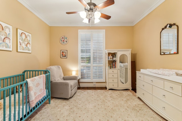701 Mason Dr, Allen, TX 75013 - bedroom featuring a nursery area, crown molding, ceiling fan, and carpet flooring