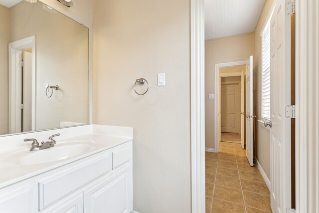 701 Mason Dr, Allen, TX 75013 - bathroom featuring tile patterned floors, baseboards, and vanity