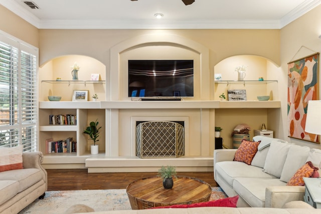 701 Mason Dr, Allen, TX 75013 - living area with wood finished floors, ornamental molding, and built in shelves