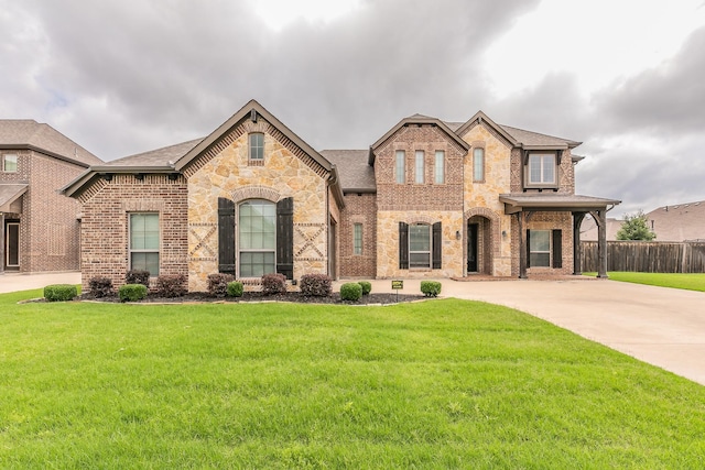 1211 Norwood St, Mansfield, TX 76063 - french country home featuring brick siding, driveway, stone siding, and roof with shingles
