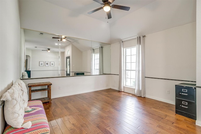 1100 Highcrest Dr, Burleson, TX 76028 - unfurnished living room featuring ceiling fan, wood finished floors, baseboards, and lofted ceiling
