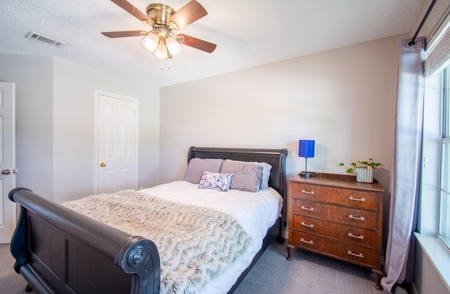 8200 Edgewater Dr, Frisco, TX 75034 - bedroom with dark colored carpet and a ceiling fan