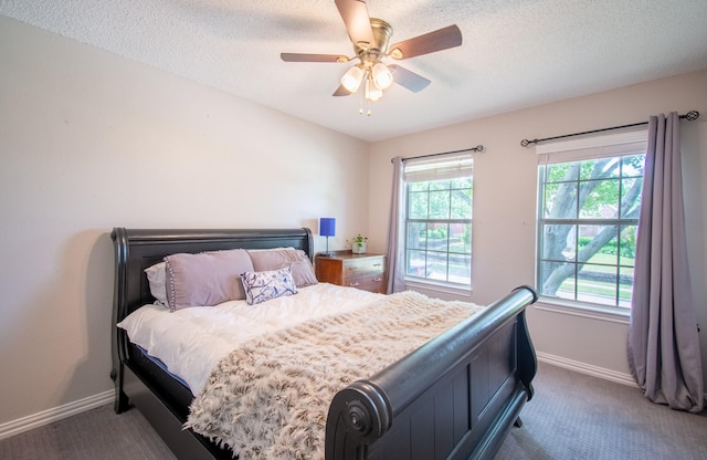 8200 Edgewater Dr, Frisco, TX 75034 - bedroom featuring carpet, baseboards, a textured ceiling, and a ceiling fan