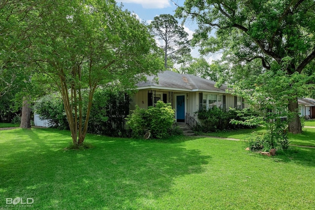 view of front of home featuring board and batten siding and a front lawn