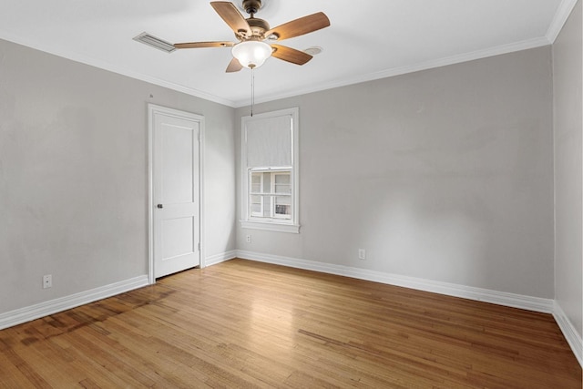 unfurnished room featuring light wood finished floors, baseboards, ceiling fan, and ornamental molding