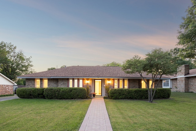 731 N Horne St, Duncanville, TX 75116 - ranch-style home featuring a front lawn and brick siding