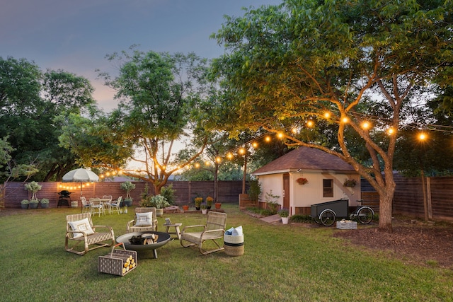 731 N Horne St, Duncanville, TX 75116 - view of yard with an outdoor fire pit, a storage shed, and an outdoor structure