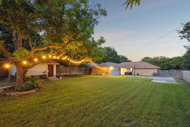 731 N Horne St, Duncanville, TX 75116 - view of yard with an attached garage and a patio