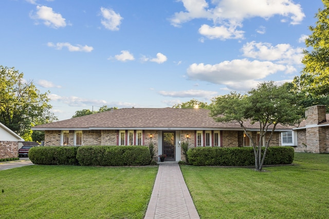 731 N Horne St, Duncanville, TX 75116 - single story home with a front lawn, brick siding, and a shingled roof