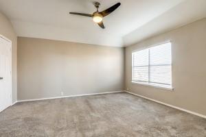 2789 Coyote Trl, Little Elm, TX 75068 - unfurnished room featuring baseboards, carpet, and a ceiling fan
