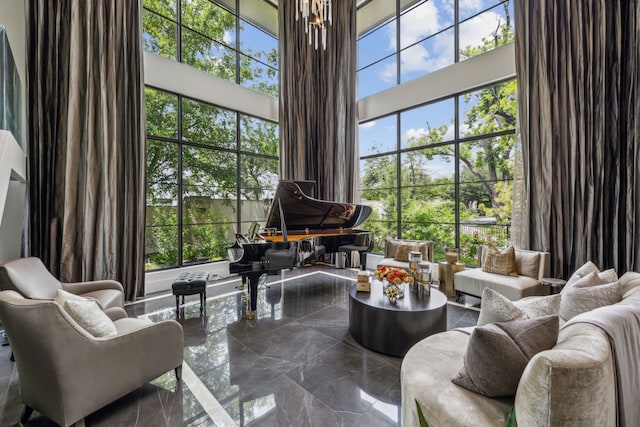 5214 Royal Ln, Dallas, TX 75229 - living area featuring dark marble finish flooring and a towering ceiling