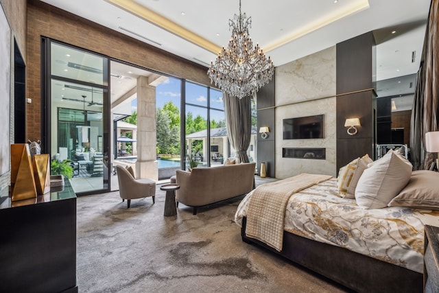 5214 Royal Ln, Dallas, TX 75229 - bedroom featuring a chandelier, access to outside, a towering ceiling, and a tray ceiling