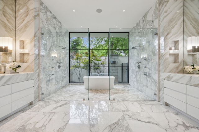 5214 Royal Ln, Dallas, TX 75229 - full bath featuring vanity, a soaking tub, marble tiled flooring, tile walls, and a shower