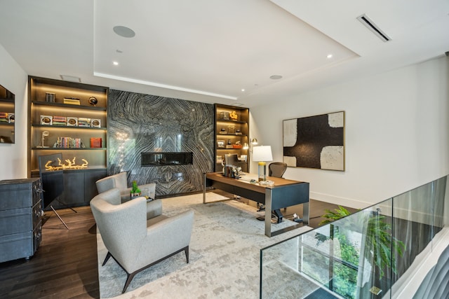 5214 Royal Ln, Dallas, TX 75229 - living area featuring a tray ceiling, a desk, wood finished floors, recessed lighting, and baseboards