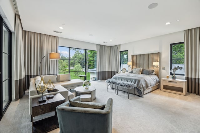 5214 Royal Ln, Dallas, TX 75229 - bedroom with multiple windows, access to exterior, recessed lighting, and light carpet