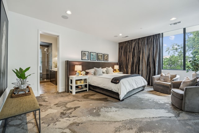 5214 Royal Ln, Dallas, TX 75229 - bedroom with recessed lighting and ensuite bath