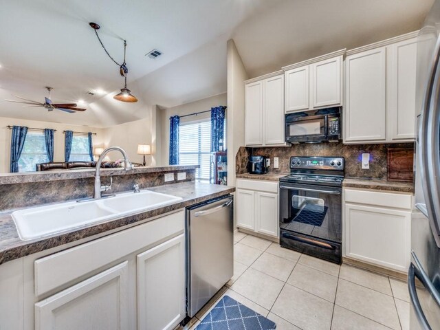 1209 Golden Eagle Ct, Aubrey, TX 76227 - kitchen featuring black appliances, a sink, vaulted ceiling, backsplash, and white cabinets