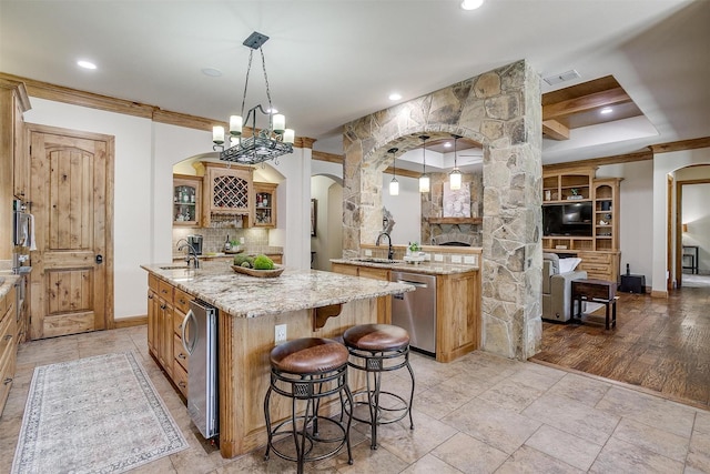 4312 Tapatio Springs Rd, Fort Worth, TX 76108 - kitchen featuring arched walkways, stainless steel appliances, a sink, a kitchen island with sink, and recessed lighting