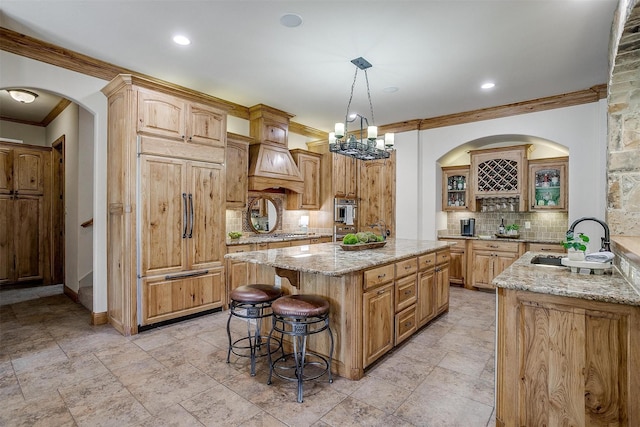 4312 Tapatio Springs Rd, Fort Worth, TX 76108 - kitchen featuring ornamental molding, a kitchen bar, tasteful backsplash, light stone counters, and a sink
