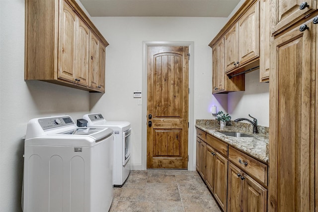 4312 Tapatio Springs Rd, Fort Worth, TX 76108 - laundry room featuring separate washer and dryer, cabinet space, light stone finish flooring, and baseboards