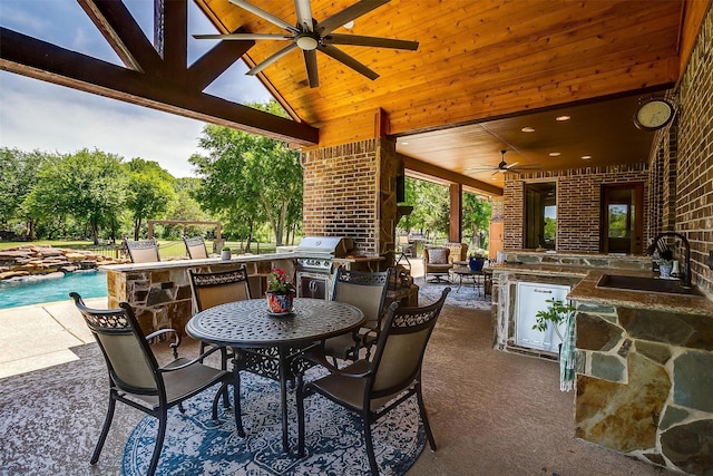 4312 Tapatio Springs Rd, Fort Worth, TX 76108 - view of patio featuring exterior kitchen, a ceiling fan, area for grilling, outdoor dining area, and an outdoor pool