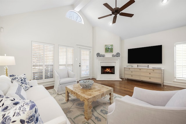 6137 Oram St, Dallas, TX 75214 - living area featuring a ceiling fan, high vaulted ceiling, beamed ceiling, a lit fireplace, and wood finished floors