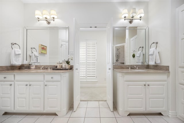 6137 Oram St, Dallas, TX 75214 - full bath featuring tile patterned floors and two vanities
