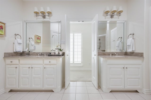 6137 Oram St, Dallas, TX 75214 - bathroom with two vanities, a stall shower, and tile patterned floors