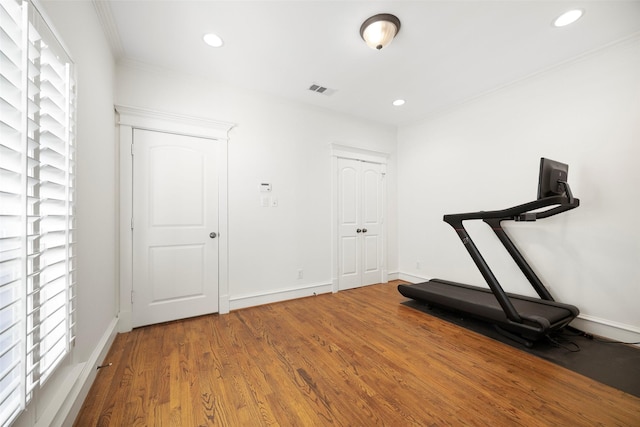 6137 Oram St, Dallas, TX 75214 - exercise area featuring wood finished floors, recessed lighting, ornamental molding, and baseboards