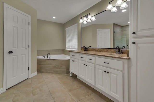 289 Cates Rd, Van Alstyne, TX 75495 - bathroom with double vanity, a garden tub, tile patterned floors, a stall shower, and a chandelier