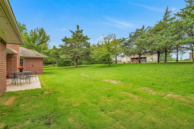 289 Cates Rd, Van Alstyne, TX 75495 - view of grassy yard featuring a patio area