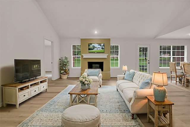 289 Cates Rd, Van Alstyne, TX 75495 - living area featuring lofted ceiling, light wood-style floors, and a fireplace