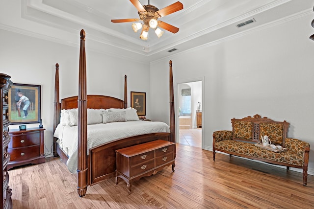 148 Arista Trl, Poolville, TX 76487 - bedroom with a tray ceiling, ornamental molding, light wood finished floors, connected bathroom, and a ceiling fan
