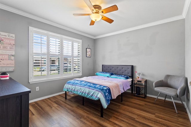 bedroom featuring wood finished floors, ornamental molding, baseboards, and ceiling fan