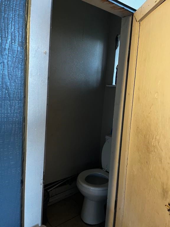 bathroom featuring toilet and tile patterned floors