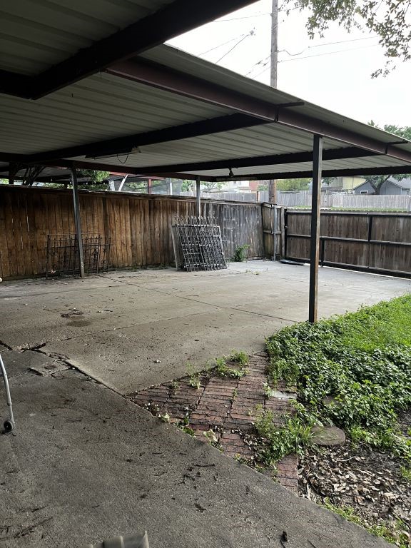 view of patio featuring fence