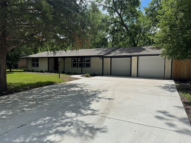 1220 Brittany Ln, Arlington, TX 76013 - ranch-style house featuring an attached garage, concrete driveway, and brick siding