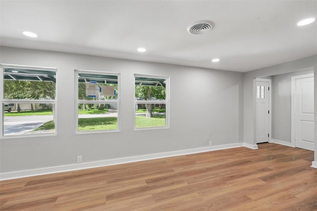 1220 Brittany Ln, Arlington, TX 76013 - empty room featuring baseboards, light wood-type flooring, and recessed lighting