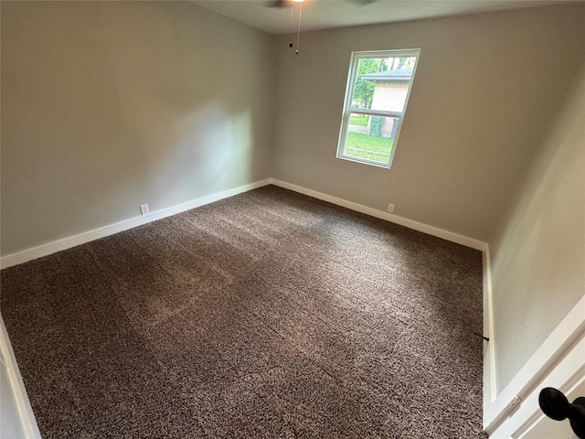 1220 Brittany Ln, Arlington, TX 76013 - spare room with dark carpet, baseboards, and ceiling fan