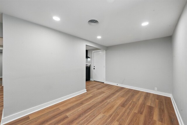 1220 Brittany Ln, Arlington, TX 76013 - spare room featuring baseboards, wood finished floors, and recessed lighting
