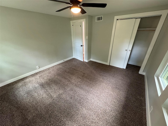 1220 Brittany Ln, Arlington, TX 76013 - unfurnished bedroom with a closet, dark carpet, baseboards, and a ceiling fan