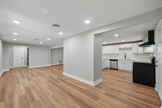 1220 Brittany Ln, Arlington, TX 76013 - unfurnished living room featuring a sink, recessed lighting, baseboards, and light wood finished floors